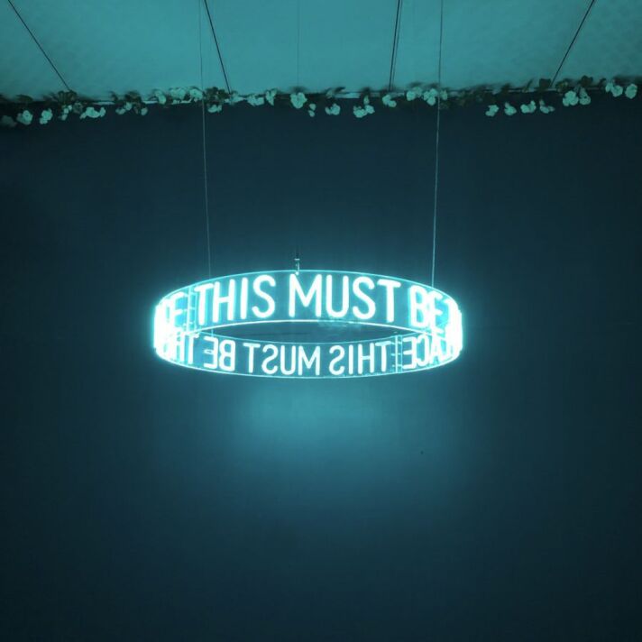 This Must Be The Place Circular Neon Sign for Modern Living Rooms