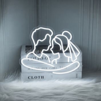 Add a Romantic Glow to Your Bedroom, Wedding, or Anniversary Celebration with the Cuddling Couple Shape Neon Sign.