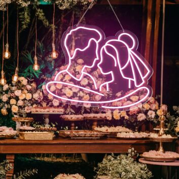 Add a Romantic Glow to Your Bedroom, Wedding, or Anniversary Celebration with the Cuddling Couple Shape Neon Sign.