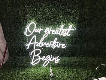 Light Up Your New Chapter: Our Greatest Adventure Begins White LED Neon Sign for Weddings, Home Decor, and Celebratory Events.