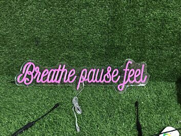 Brighten Up Your Space: Breathe Pause Feel Pink LED Neon Sign Perfect for Home Decor, Relaxing Office Environments, and Trendy Bar Settings.