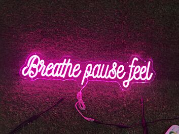 Brighten Up Your Space: Breathe Pause Feel Pink LED Neon Sign Perfect for Home Decor, Relaxing Office Environments, and Trendy Bar Settings.