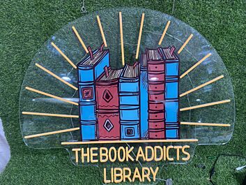 Brighten Your Reading Nook, Office, or Storefront with The Book Addicts Library UV Print LED Neon Sign.