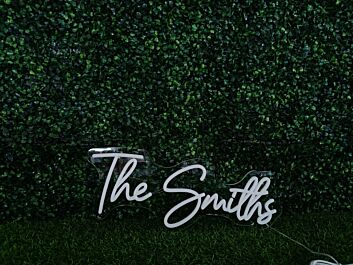 Elevate your office, wedding, or bar ambiance with The Smiths White LED Neon Sign.