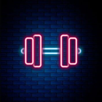 A Glowing Barbell Neon Sign Hung On The Brick Wall Background