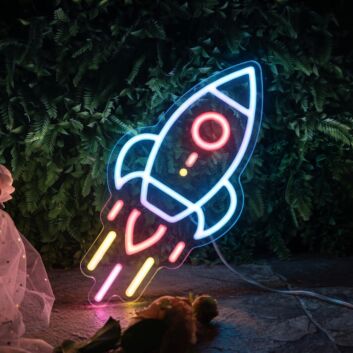 Neon Rocket Sign Hung On The Brick Background