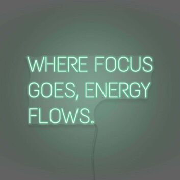 Where Focus Goes Energy Flows Neon Lettering Inspiring Concentration and Success