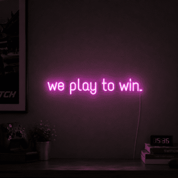 'We play to win' neon sign
