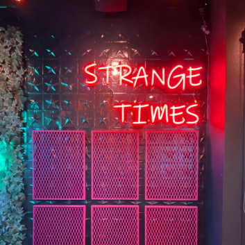 Strange Times: Illuminate Your Space with an Eccentric Vibe - Neon Sign