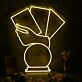 Hand Holding Fanned Cards Above a Circle LED Neon Sign
