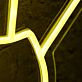 Hand Holding Fanned Cards Above a Circle LED Neon Sign