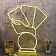 Hand Holding Fanned Cards Above a Circle LED Neon Sign