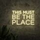 This Must Be the Place Three-Line Yellow Block-Letter LED Neon Sign