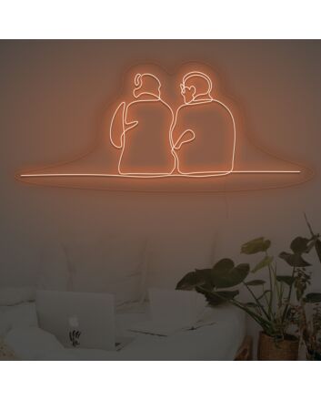 Couple Sitting Together Neon Sign