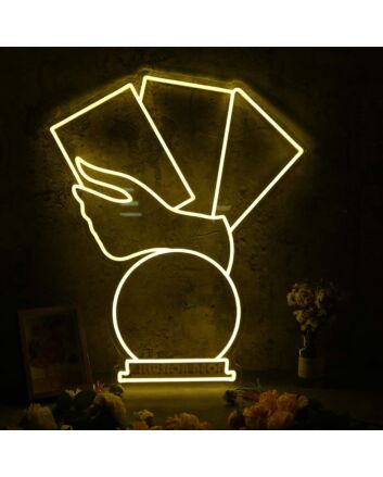 A Hand Holding Books Yellow Neon Sign