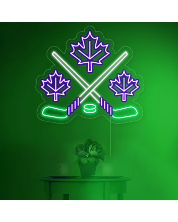 Maple leaves with crossed hockey sign in neon light