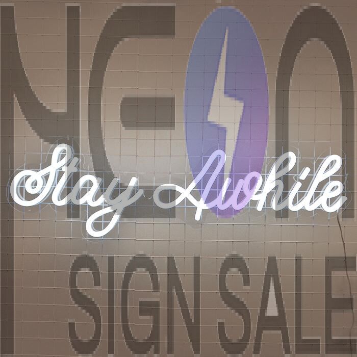 Stay Awhile Neon Sign perfect for cozy living room settings