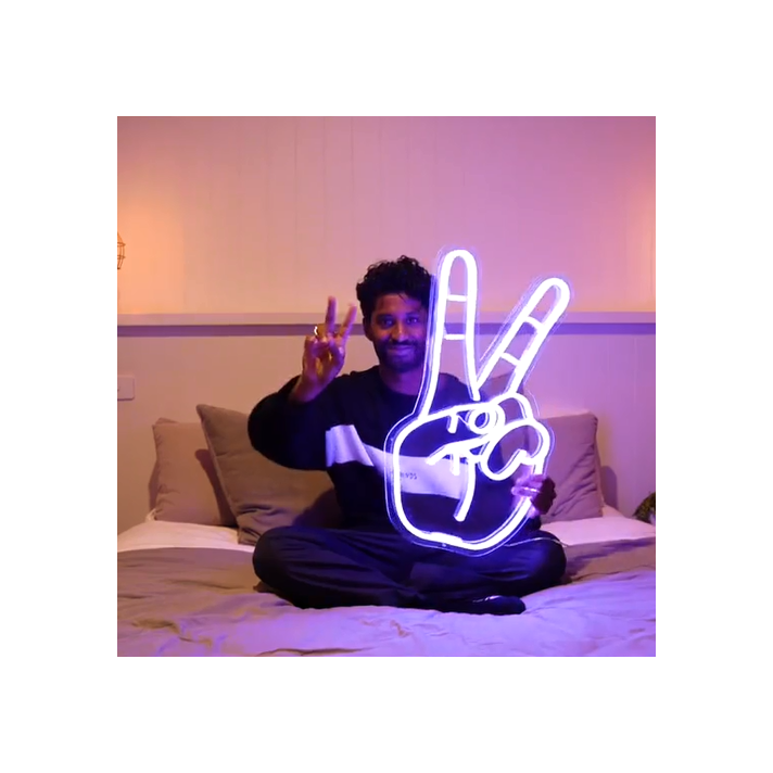 Peace hand symbol neon sign
