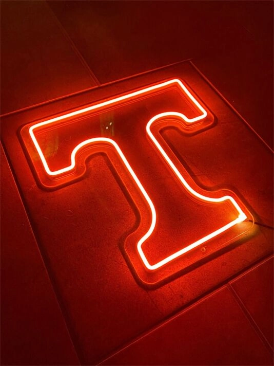 Brighten Up Your Bar, Office, or Home Decor with the Stylish T Logo LED Neon Sign.