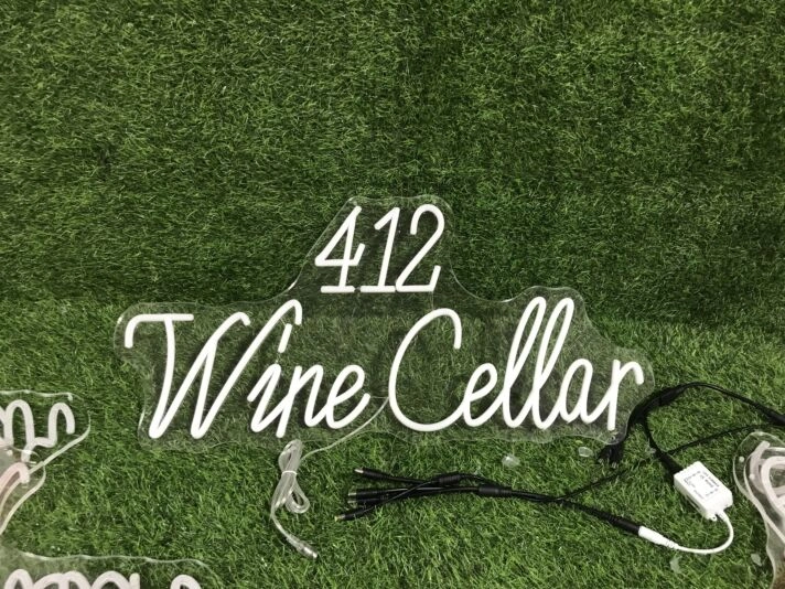Enhance Your Wine Cellar, Bar, or Wedding Ambiance with the 412 Wine Cellar Yellow Neon Sign.