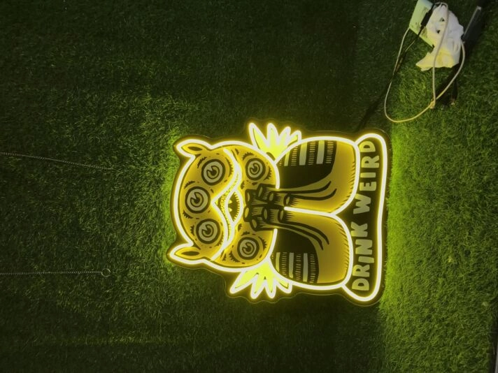 Elevate Your Bar, Office, or Party Ambiance with the Drink Weird UV Print LED Neon Sign.