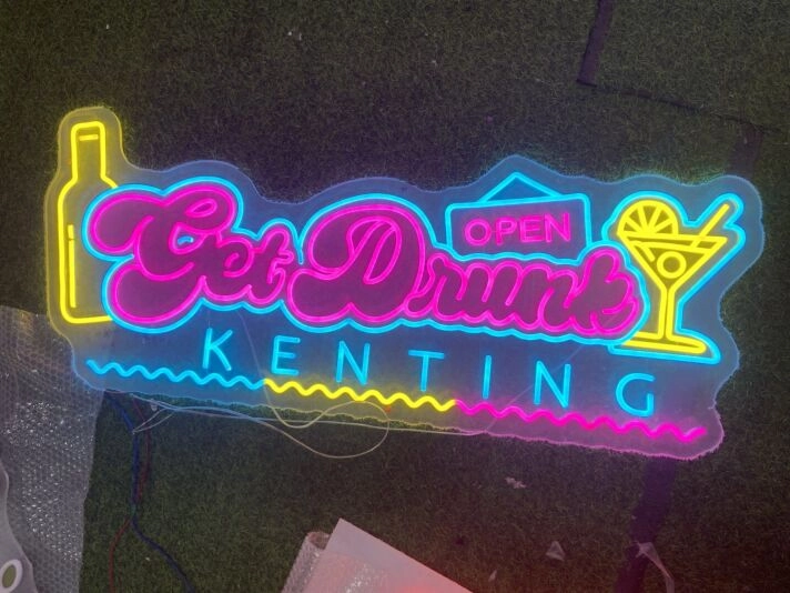 Elevate your bar or party ambiance with the vibrant Get Drunk Kenting Open Neon Sign.