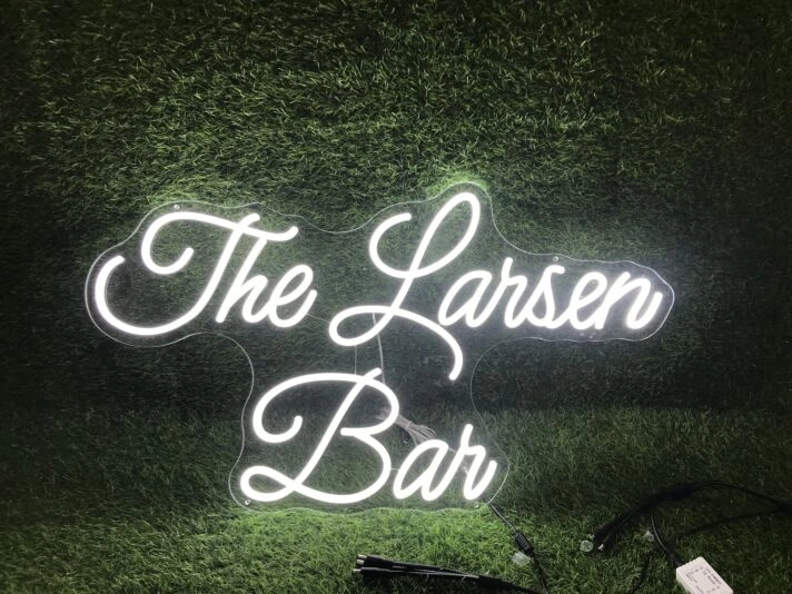 Brighten Up Your Bar, Office, or Wedding with The Larsen Ban White LED Neon Sign.