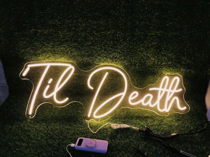 Brighten Your Wedding, Bar, and Home with the Unique Glow of the Yellow Til Death LED Neon Sign.