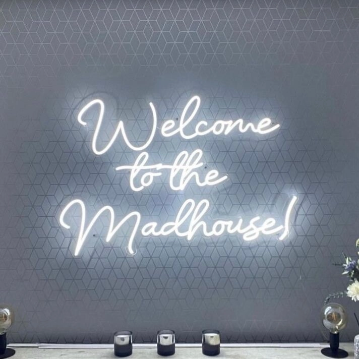 'Welcome To The Madhouse' Neon Sign