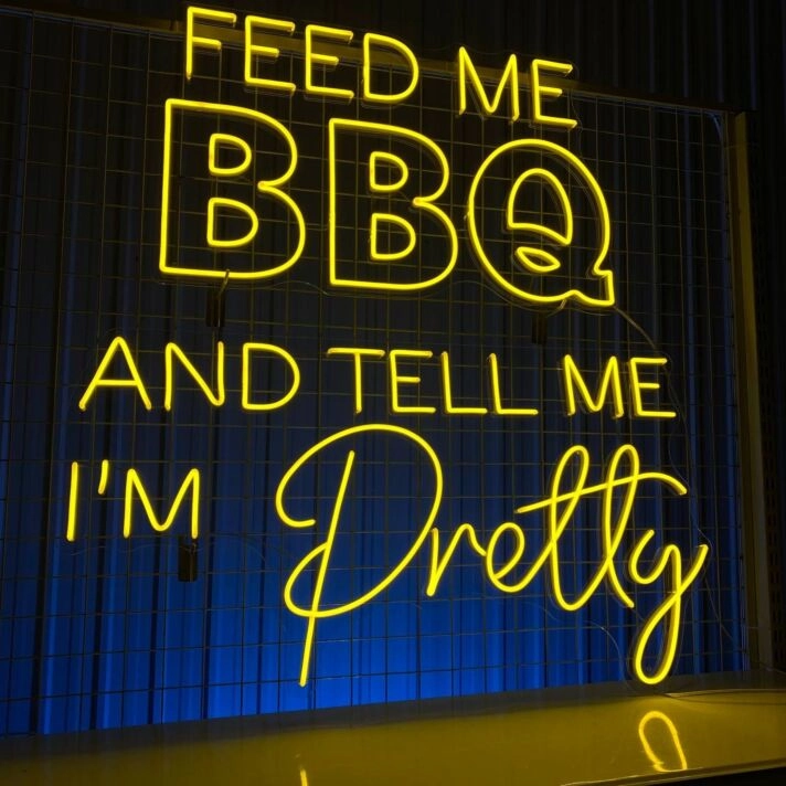 Brighten Up Your Kitchen or Backyard Bash with the "Feed Me BBQ and Tell Me I'm Pretty" LED Neon Sign