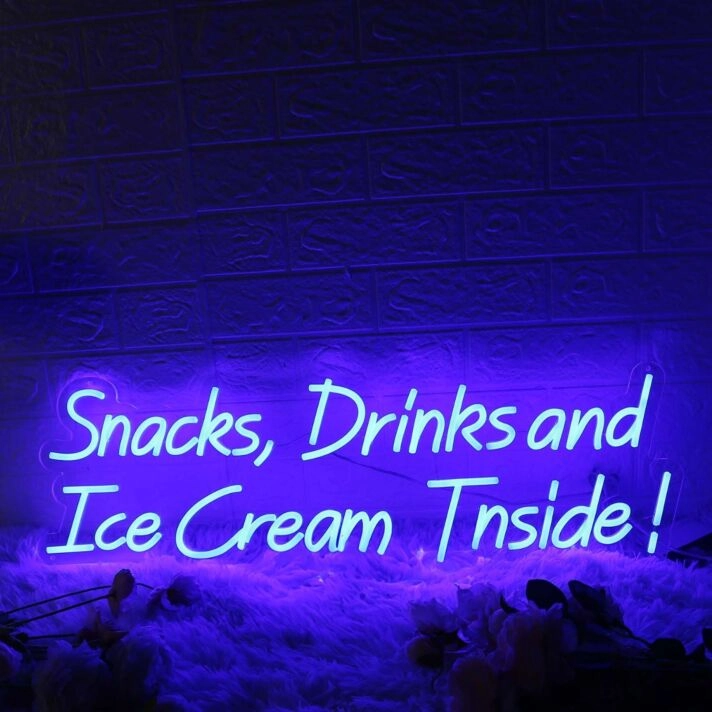 Snacks Drinks And Ice Cream Inside Blue Neon Sign