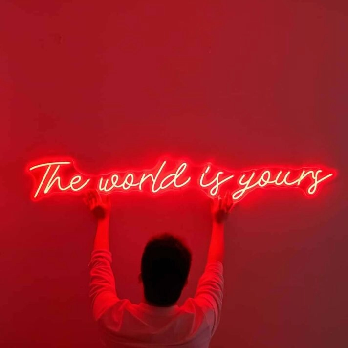 The World Is Yours Cursive Letter Neon Sign