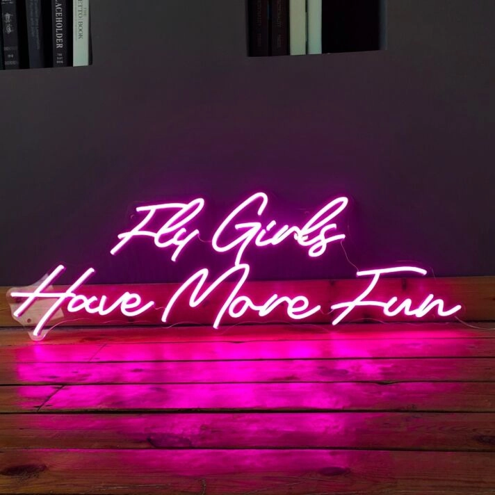 'Fly girls have more fun' neon sign