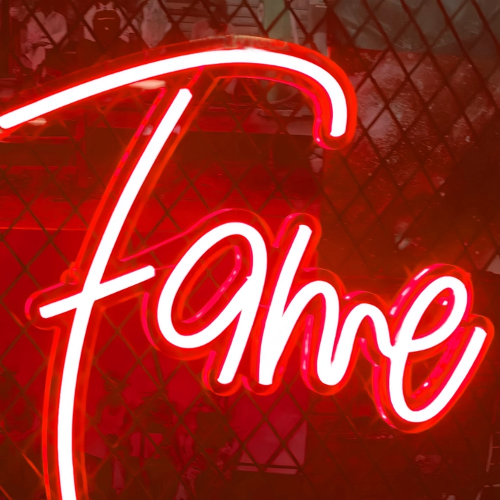 Fame Neon Sign Illuminated: Shine Bright Like a Star