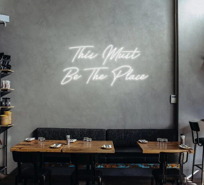 This Must Be The Place Neon Sign for Positive and Fun Spaces