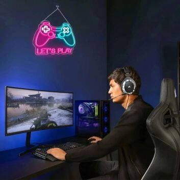 Brighten Up Your Gaming Room, Bar, or Teen&#039;s Bedroom with the Deep Pink And Ice Blue Patchwork Gamepad Neon Sign.