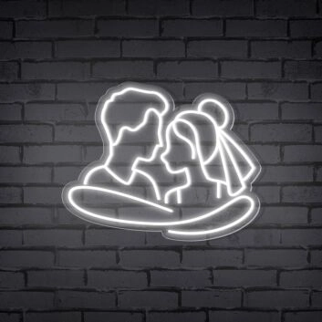 Add a Romantic Glow to Your Bedroom, Wedding, or Anniversary Celebration with the Cuddling Couple Shape Neon Sign.