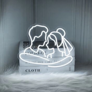 Add a Romantic Glow to Your Bedroom, Wedding, or Anniversary Celebration with the Cuddling Couple Shape Neon Sign.