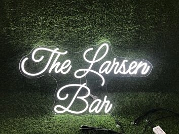 Brighten Up Your Bar, Office, or Wedding with The Larsen Ban White LED Neon Sign.