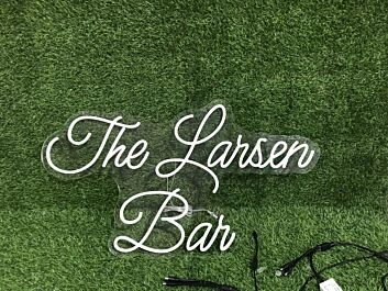 Brighten Up Your Bar, Office, or Wedding with The Larsen Ban White LED Neon Sign.