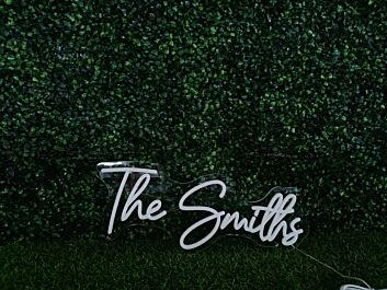 Elevate your office, wedding, or bar ambiance with The Smiths White LED Neon Sign.