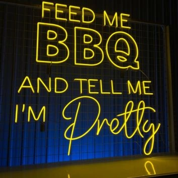 Brighten Up Your Kitchen or Backyard Bash with the "Feed Me BBQ and Tell Me I'm Pretty" LED Neon Sign