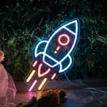 Neon Rocket Sign Hung On The Brick Background