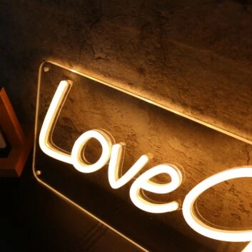 Love Grows Yellow Neon Sign