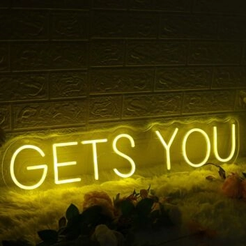 GETS YOU Yellow Neon Sign