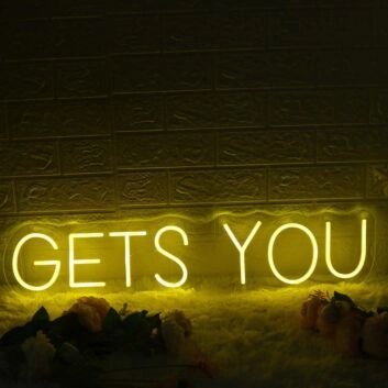 GETS YOU Yellow Neon Sign