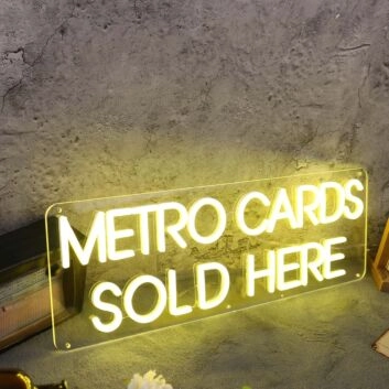 Metro Cards Sold Here Yellow Neon Sign
