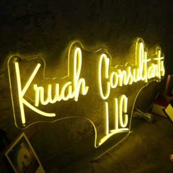 Kruah Consultants LLC Yellow Neon Sign