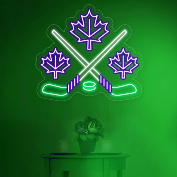 Maple leaves with crossed hockey sign in neon light