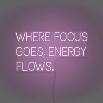 Where Focus Goes Energy Flows Neon Lettering Inspiring Concentration and Success